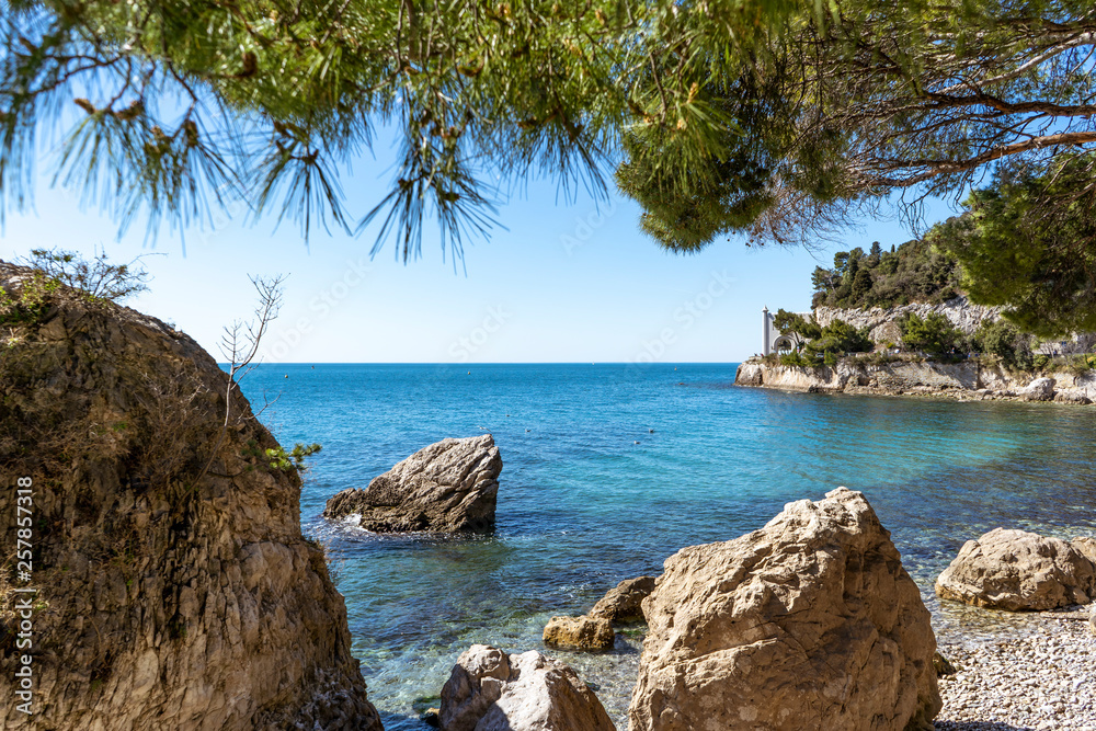 Fototapeta premium Beautiful sunny rocky beach in Miramare's park, Trieste Italy