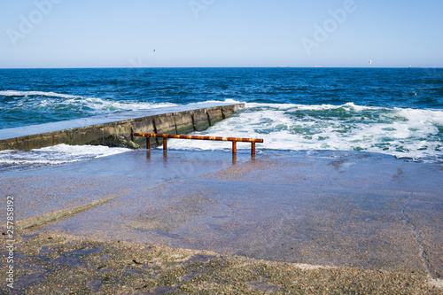 Sea waves on the beach  bright blue water