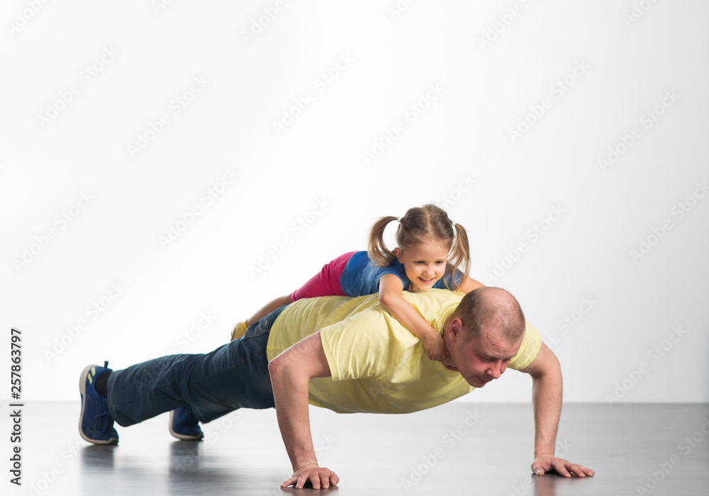 Naklejka premium young man playing with baby