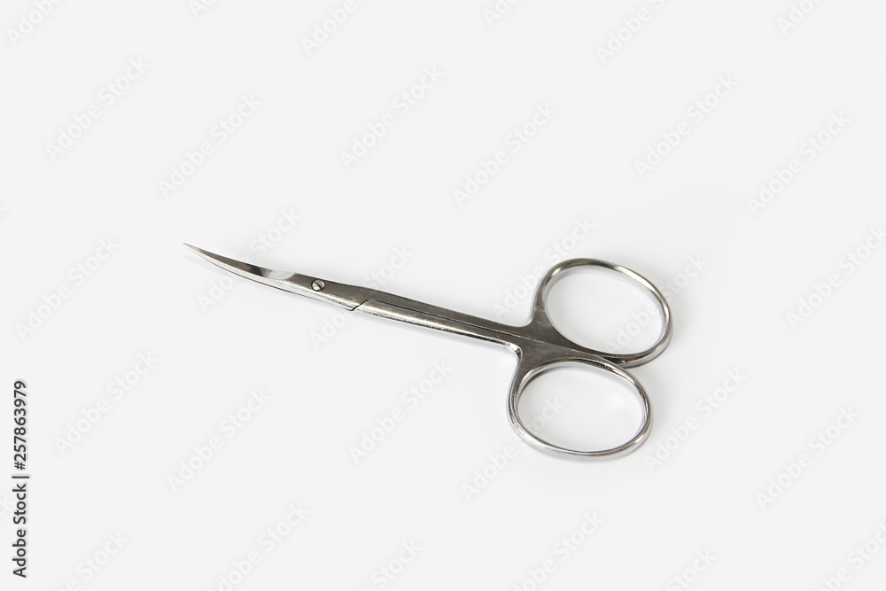metallic silver manicure sharp scissors on a white background metallic silver manicure sharp scissors on a white background