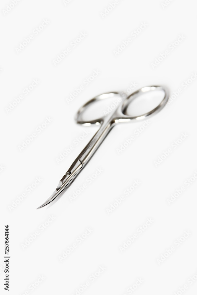 metallic silver manicure sharp scissors on a white background metallic silver manicure sharp scissors on a white background