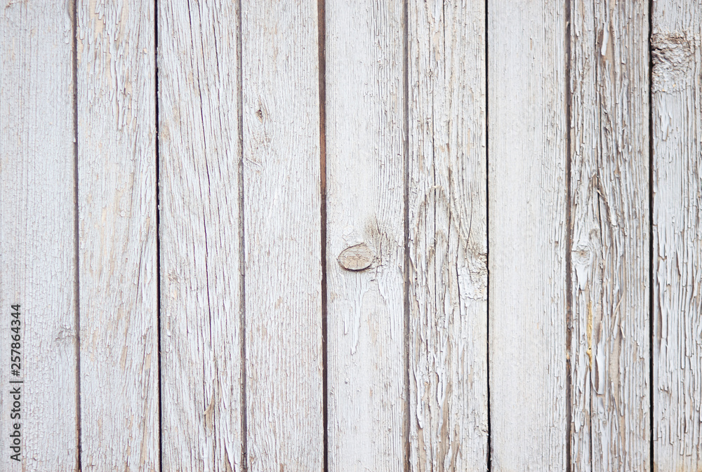 Naklejka premium Pleasant abstract empty background of wooden boards, painted with white paint, which eventually began to crumble