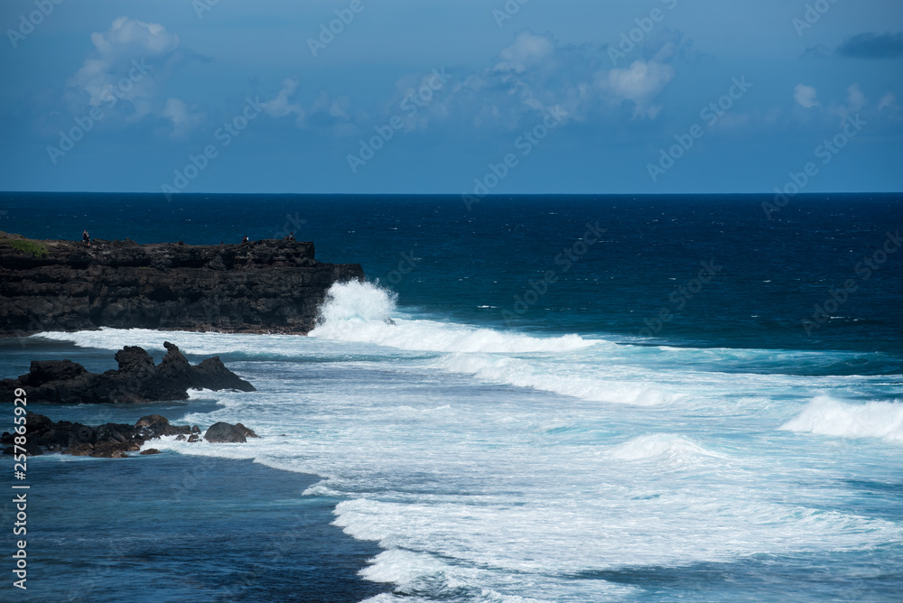 Powerful waves crashing island shore