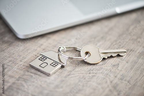 House keys on a house shaped keychain