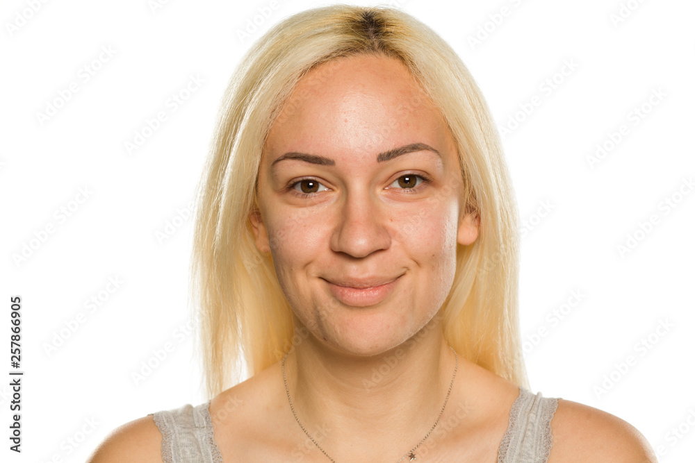 Young smiling blonde without makeup on white background Young smiling blonde without makeup on white background