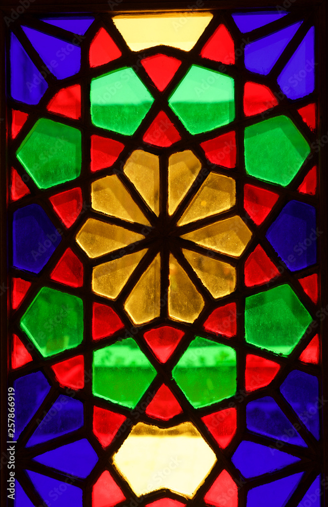 Fragment photo of stained glass window. Colorful glass. Colorful window.Iranian art. Persia, Iran. Fragment photo of windows in mosque