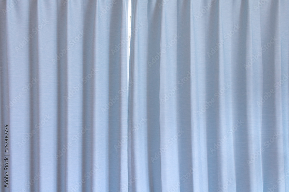 Fototapeta premium 水色のカーテンの背景