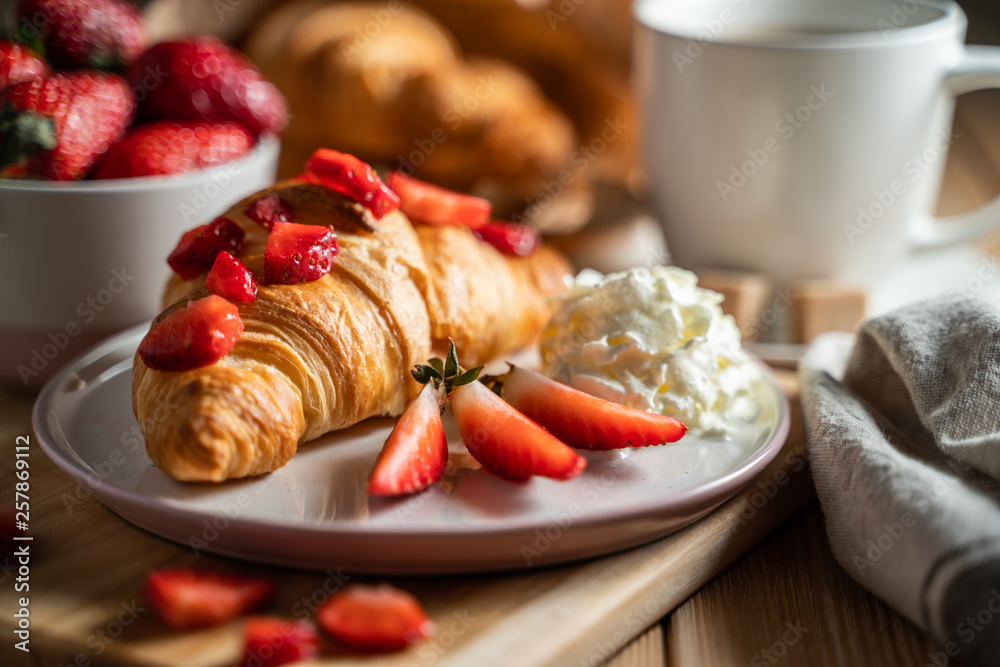 Delicious continental breakfast with fresh flaky croissantsl and coffee