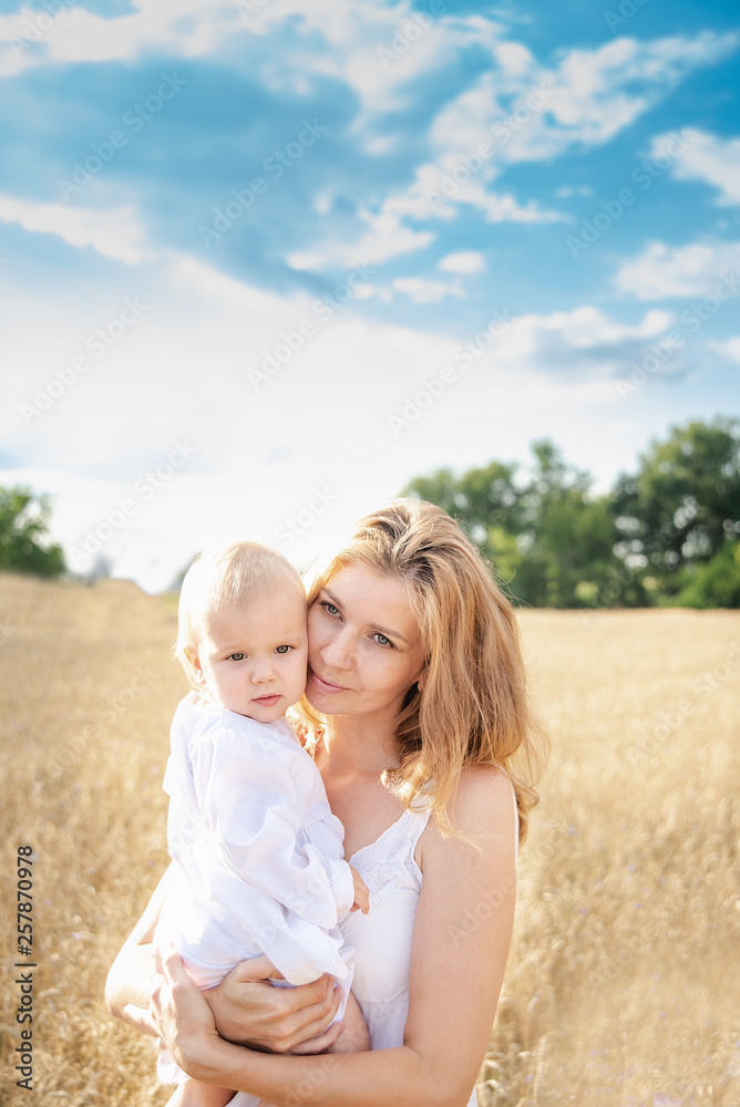 Beautiful elegant mother and little daughter wheat field, family Beautiful elegant mother and little daughter wheat field, family