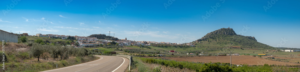 Panoramic view of the village of Alange with its castle on top of the mountain, next to the marsh of the same name, locality famous for its Roman baths and located Very close to the city of Merida.