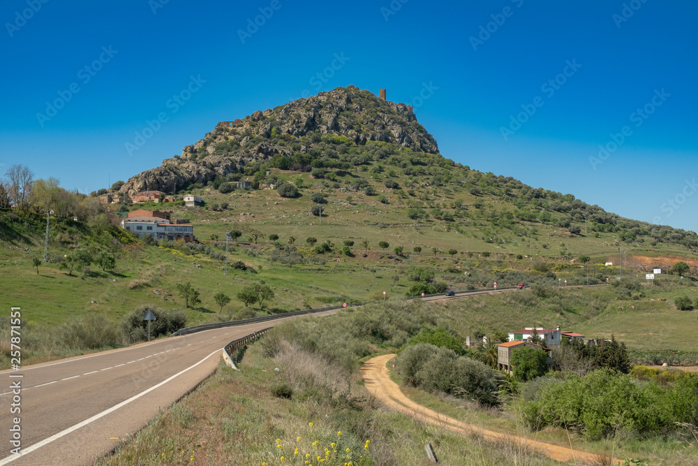 View of the village of Alange with its castle on top of the mountain, next to the marsh of the same name, locality famous for its Roman baths and located Very close to the city of Merida.