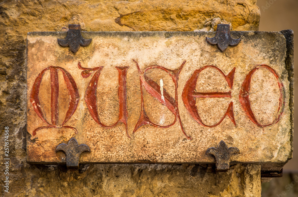 Old Medieval sign with red letters - Museum text in Italian