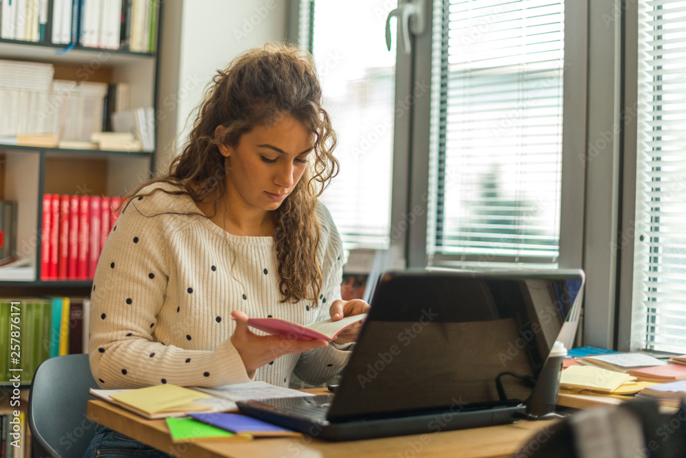Female student learning in library