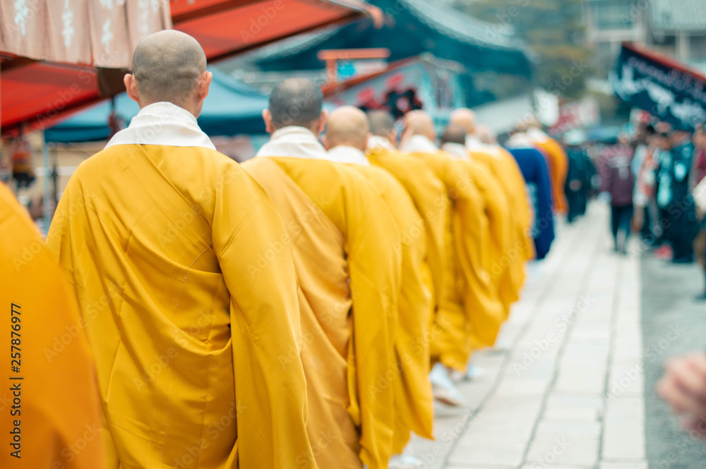 Buddhist monks walking down busy market - Kyoto