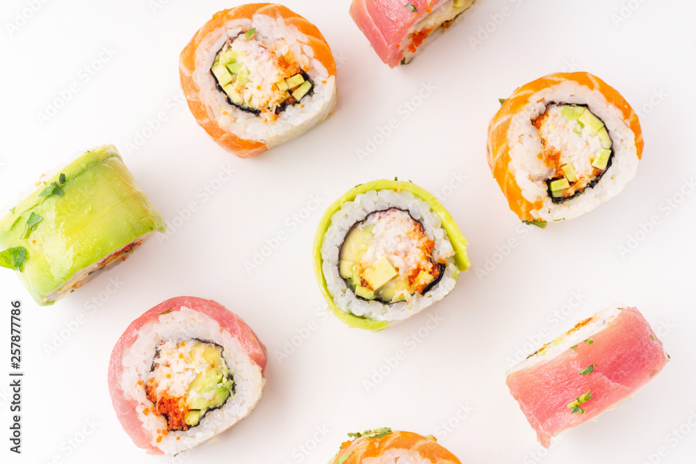 Flat lay with colorful sushi rolls with crab meat on white background Flat lay with colorful sushi rolls with crab meat on white background