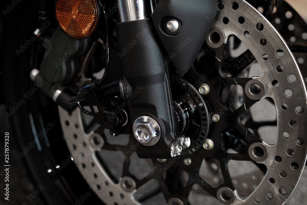 closeup tire and dish bake of sport motorcycle ( big bike ) with soft-focus and over light in the background closeup tire and dish bake of sport motorcycle ( big bike ) with soft-focus and over light in the background