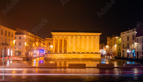 Maison Carree, temple in night lights, Nimes, France photo