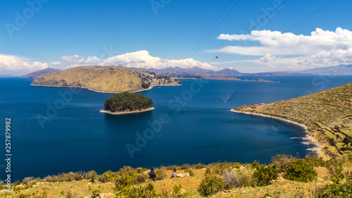Terraced landscape of Isla del Sol with Andes mountains in the background on the Bolivian side of Lake Titicaca photo