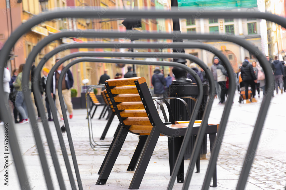 View of bench in european center of Gdansk, poland, View throgh bicycle parking View of bench in european center of Gdansk, poland, View throgh bicycle parking