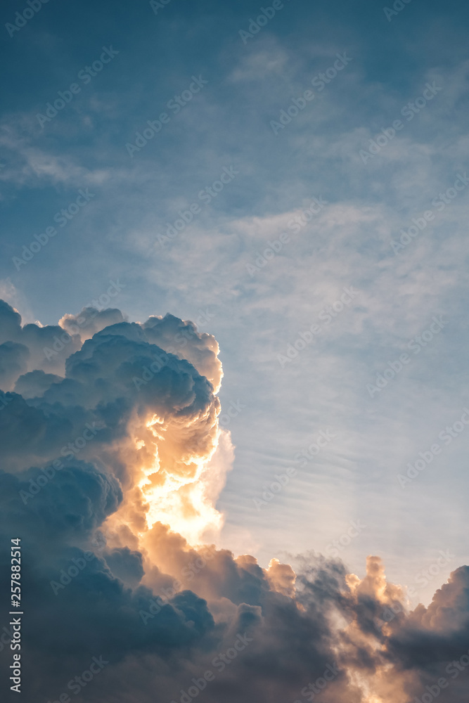 Dramatic large cumulus clouds on the sky at sunset Dramatic large cumulus clouds on the sky at sunset