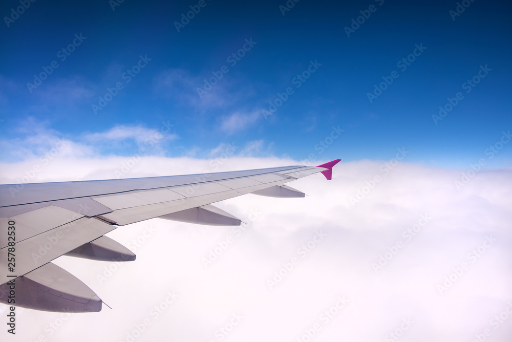Concept of traveling around the world. Clouds forming interesting patterns and textures in the sky. Safe travel and professional pilot. Concept of traveling around the world. Clouds forming interesting patterns and textures in the sky. Safe travel and professional pilot.