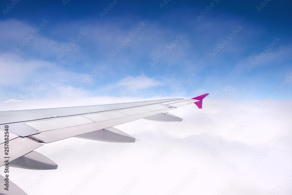 Concept of traveling around the world. Clouds forming interesting patterns and textures in the sky. Safe travel and professional pilot. Concept of traveling around the world. Clouds forming interesting patterns and textures in the sky. Safe travel and professional pilot.