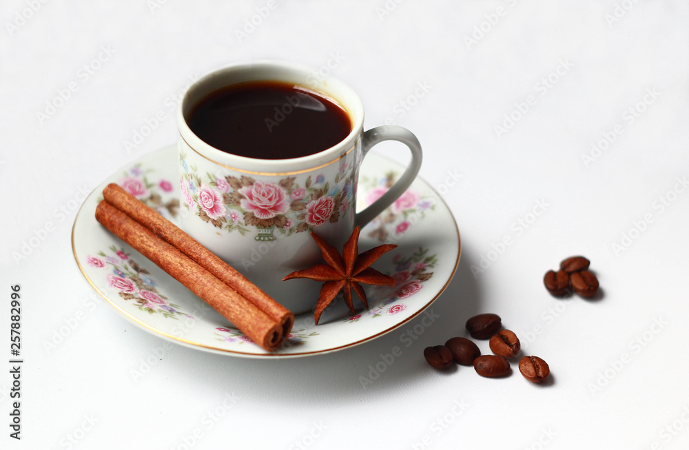 Fototapeta premium cup of coffee, grains of coffee, cinnamon, star anise