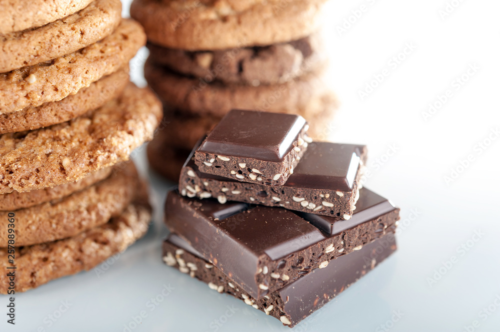 Various shortbread, oat cookies, chocolate chip biscuit and pieces of chocolate with seeds and nuts. Various shortbread, oat cookies, chocolate chip biscuit and pieces of chocolate with seeds and nuts.