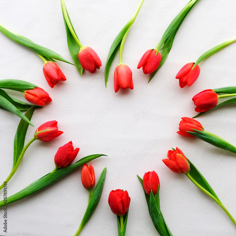 Heart symbol made of fresh blooming red tulips