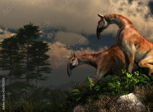 A pair of macrauchenia stand on a grassy hillside. These animals are now extinct but live in South America during the Pleistocene era. 3D Rendering.