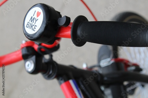 Bicycle steering wheel with bell and handles.