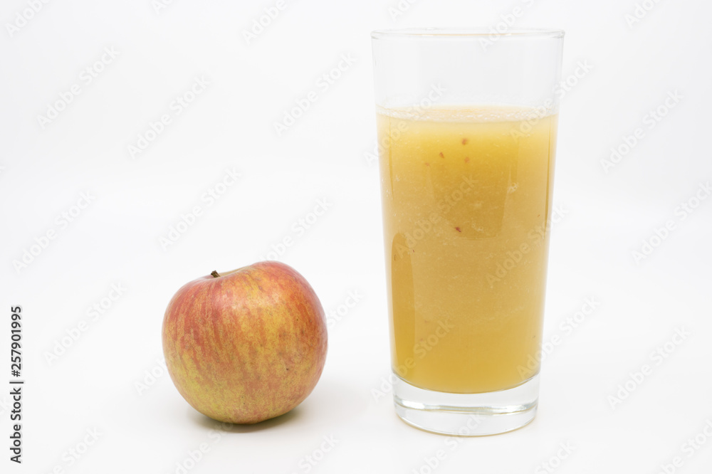Glass of homemade apple juice with a red apple Glass of homemade apple juice with a red apple