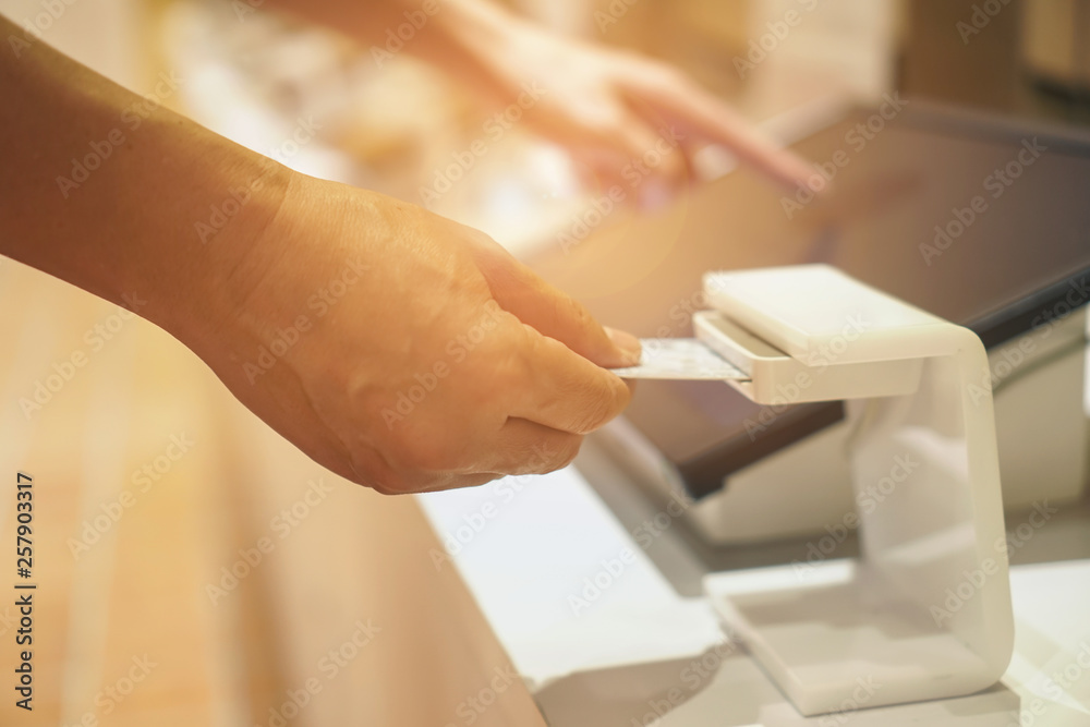 Obraz premium man person inserting card into scanner