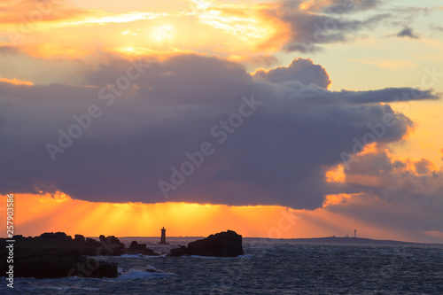 Four lighthouse and Ouessant Island at sunset seen from the touristic road, Landunvez, Brittany, France  photo