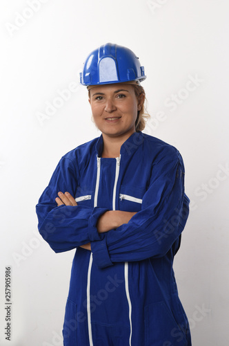 female worker in blue working on white background