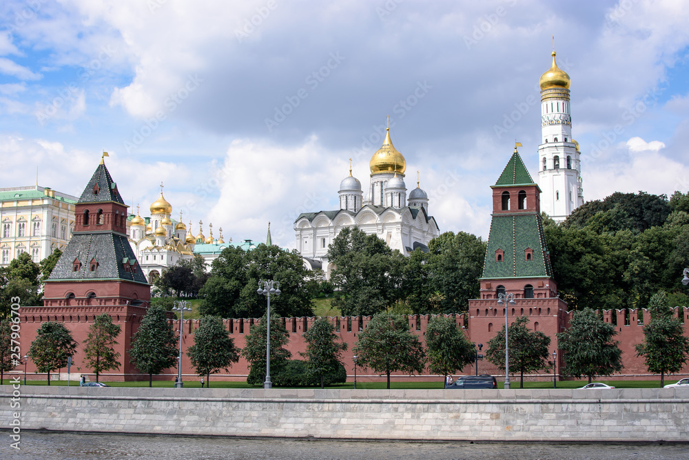 RUSSIA, MOSCOW - June 30, 2017:View of the Kremlin across the river, temples with golden domes RUSSIA, MOSCOW - June 30, 2017:View of the Kremlin across the river, temples with golden domes