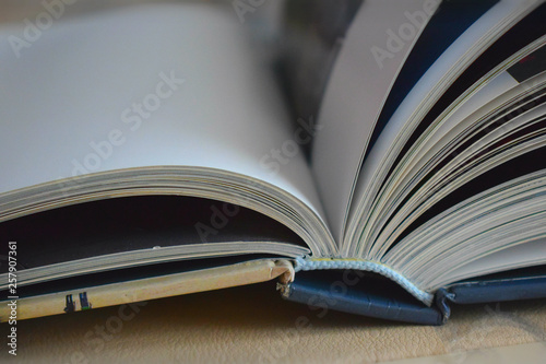 open book on wooden table