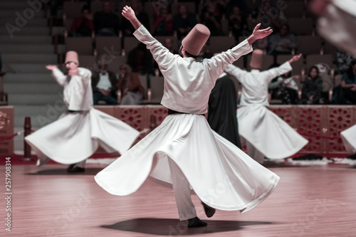 Unidentified whirling Dervishes or Semazen in Konya photo