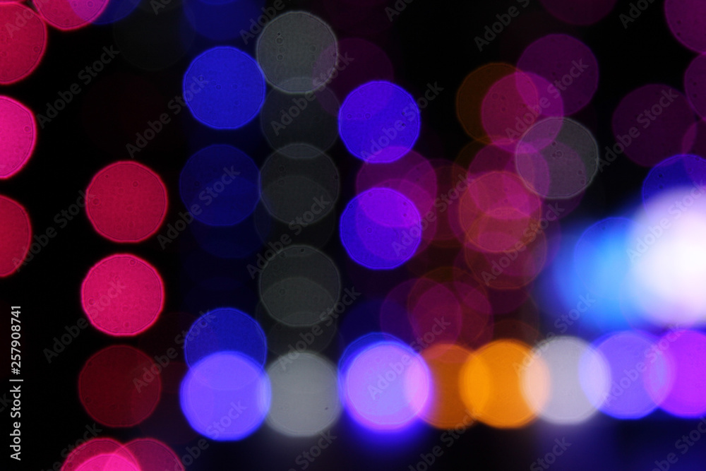 colourful led lights bulbs in bokeh effect in black background.blurred lights effect. colourful led lights bulbs in bokeh effect in black background.blurred lights effect.