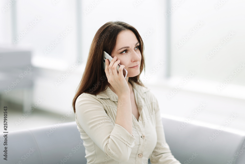 young business woman talking on a mobile phone . young business woman talking on a mobile phone .