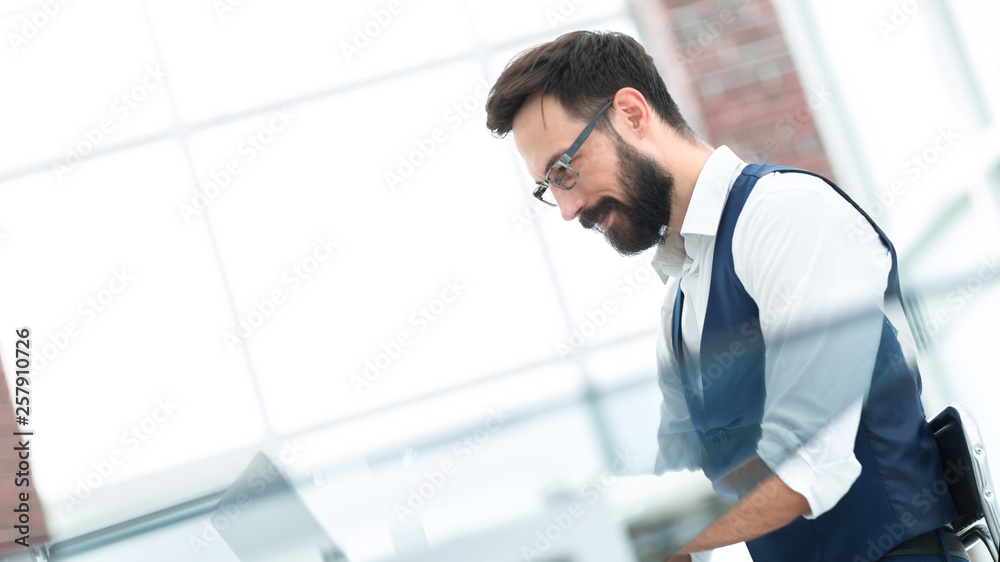 image of a businessman sitting at his Desk. image of a businessman sitting at his Desk.