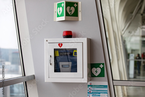 defibrillator attached to the wall at the airport photo