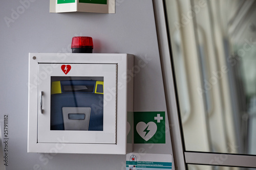 defibrillator attached to the wall at the airport photo