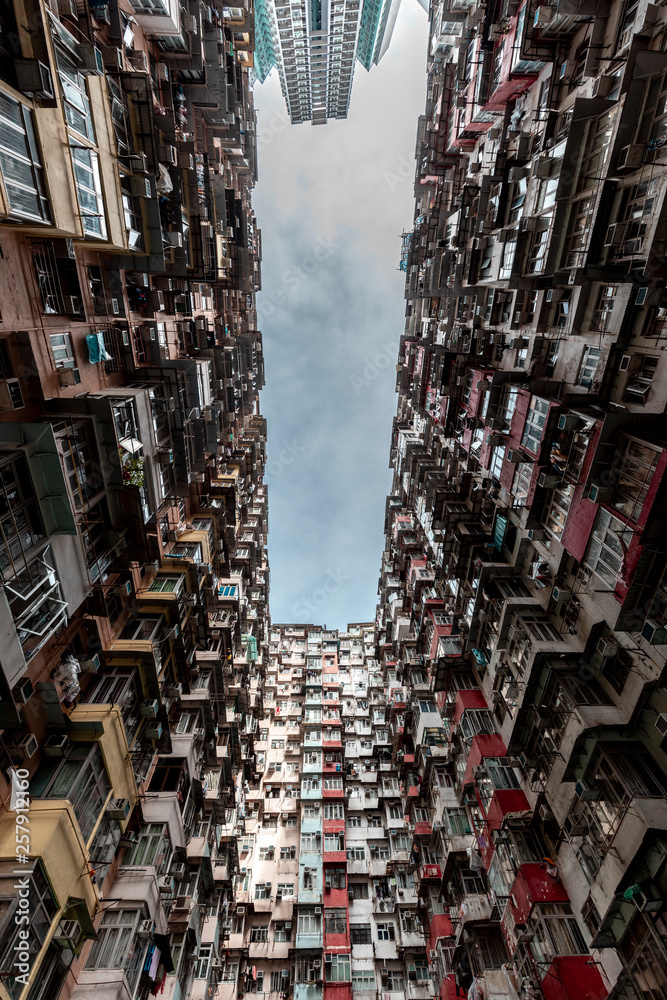 Hong Kong, Quarry Bay, apartment blocks contrasting with modern skyscraper Hong Kong, Quarry Bay, apartment blocks contrasting with modern skyscraper