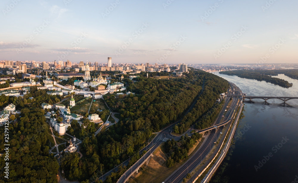 Aerial panoramic  top view of Kiev Pechersk Lavra churches on hills from above, cityscape of Kyiv city