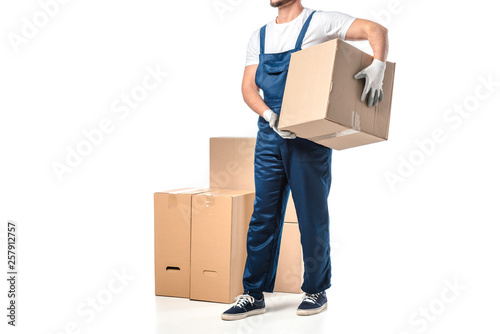 cropped view of mover in uniform carrying cardboard box isolated on white with copy space