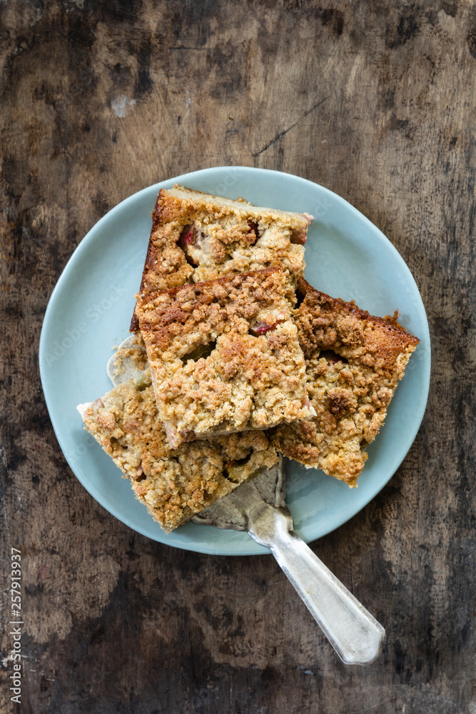 Rhubarb cake and a cake server on plate Rhubarb cake and a cake server on plate
