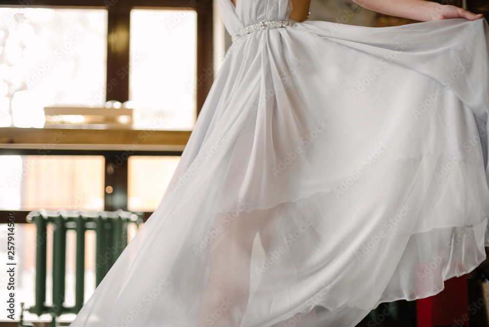 Woman is spinning in a dress