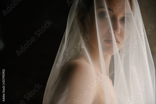 Canvas Print Bride posing close up in a veil