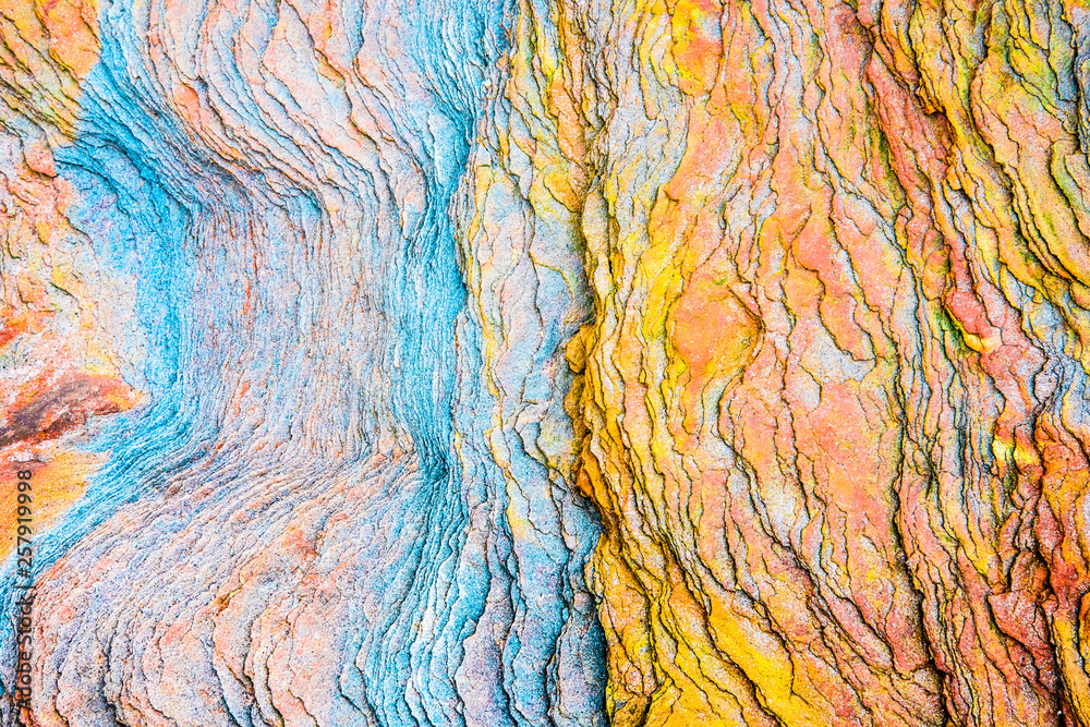 Colourful sedimentary rocks formed by the accumulation of sediments – natural rock layers backgrounds, patterns and textures - abstract graphic design – geology – nature formations - obrazy, fototapety, plakaty 